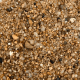 Gros plan grain de sable Valley Sand teintes dorées et ambrées 0,1-4 mm
